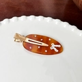 Amber acetate hair claw with rhinestones and hollow patterns in a white porcelain dish - Side Clips / 6.2cm / Coffee
