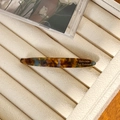 Elegant tortoiseshell acetate hair clip in amber and brown tones on velvet display - 6.7cm / Blue Brown
