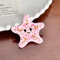 Molletta per capelli a stella marina rosa in acetato con glitter e viso sorridente - Stella marina