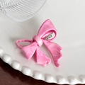 Pink marble-patterned acetate hair clip in a 3D bow design with a metal duckbill clip - Pink Hair Clip