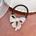 Black elastic hair tie with an iridescent pearlescent acetate bow charm for women - Iridescent White Hair Tie