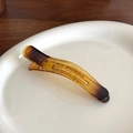 Translucent amber jelly hair clip with a smooth resin finish and non-slip duckbill grip - Yellow
