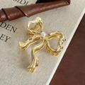 Elegant gold butterfly hair claw clip with pearl center in fluid metal design - Gold Butterfly Bow with Pearl