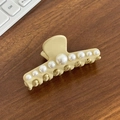 Elegant beige hair claw clip with nine white pearls on a dark wooden surface - Artificial Pearl Decor Style / Large (8.5cm) / Beige