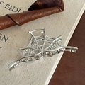 Silver alloy spider web hair claw clip with polished metallic finish for styling - Silver Spider Web Claw