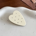 Elegant cream heart hair clip with sparkling rhinestones on a decorative ceramic tray - Milk White