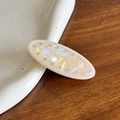 Elegant oval cream marble hair clip with sparkling rhinestones and pearlescent finish - White