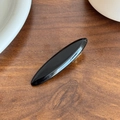 Minimalistische schwarze ovale Haarspange aus Acetat mit Hochglanz auf Holzgrund - Schwarz-6.3cm