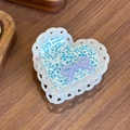 Blue leopard heart hair claw with light purple bow accent on natural wood texture - Floral Blue