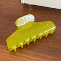 Elegant lime green acetate hair claw clip with rhinestones on a dark wood background - 10.9cm / Green