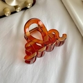 Amber brown geometric hollow resin hair claw clip with stylish wavy s-shaped design - Wave-Orange Red / 8.1cm