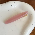 Pink handmade acetate oval hair clip with gold logo detail and sturdy metal fastener - 6.2cm / Pink