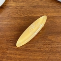 Elegant amber acetate oval hair clip with white shell shimmer flakes on wood background - 5.9cm / Yellow