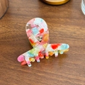 Colorful acetate claw clip with vibrant marble pattern and gold Barrette La France text - Colorful Splash
