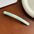 Blue marble texture acetate hair barrette with gold lettering on a wooden table - 10.6cm / Blue & White