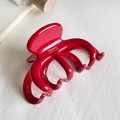 Glossy red octopus hair claw clip with gold France Handmade logo on white fabric - Red With Gold Stamp