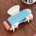 Pinza per capelli a forma di matita azzurra in acetato con strass su piano di legno - 9.2cm / Blu