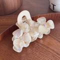 Elegant cream acetate hair claw clip featuring 3D rhinestone flowers with pearl finish - Iridescent White