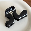 Glossy black acetate hair claw clip with a unique wavy geometric design and metal spring - Black (No Gold Label)