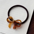Elegant tortoiseshell acetate bow hair tie in dark brown with a high-elasticity band - Brown