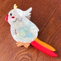 Cute parrot shaped acetate claw clip with white pearlescent finish and colorful details - Multicolor Tail Parrot