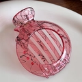 Translucent pink resin hair claw clip with black ink patterns and golden metal spring - Red