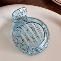 Translucent blue round hair claw with ink line patterns and small blue beads - Blue