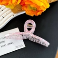 Detailed close-up of pink marble texture hair claw clip with golden metal spring - Floral Pink Large