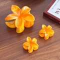 Frangipani flower hair claw set with orange marble texture and high gloss finish - One Large And Two Small / Orange Set