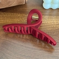 Matte dark red silicone shark hair claw clip for thick hair styling on wooden surface - Twist-Red