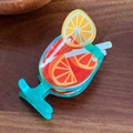 Pinza per capelli a forma di cocktail in acrilico arancione e verde per acconciature - Calice Blu