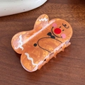 Cute gingerbread man hair claw clip in orange marble finish for Christmas styling - Gingerbread Man