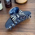 Navy and cream striped bow hair claw clip with glossy finish on a wooden surface - Blue Beige Claw Clip