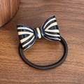 Elegant navy blue and cream striped bow hair tie on a rustic wooden background - Blue Beige Hair Tie