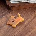 Cute amber brown acetic acid puppy hair clip with smooth texture on a wooden tray - Dog Style / Coffee Dog