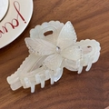 Elegant white butterfly hair claw with pearls and rhinestones on a wooden surface - White Bowknot