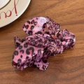 Pink leopard print butterfly hair claw clip with a heart gemstone on a wooden surface - Shark Clip-Colorful Pattern