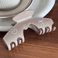 Mocha brown trapezoid hair claw clip with white dotted heart and bow tie patterns - Brown Arch Shape