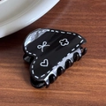 Sweet black heart hair claw with white hand-drawn ribbon and clover patterns - Black Heart Shape