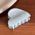 Light blue heart hair claw clip with white doodle patterns and floral designs - Blue Heart Shape