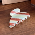 Large acetate hair claw clip with red and grey striped pattern on wood background - Small Semicircle Red Striped
