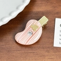 Pink marbled resin hair clip with gold bear detail and rhinestones on a wooden surface - Little Bear Rhinestone Hair Clip / Striped Pink