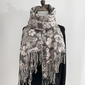 Grey floral pashmina scarf with camellia pattern and fringe tassels on a mannequin - Light Pink