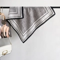 Silver-gray paisley silk scarf with black borders and plaid pattern on display - Gray / 68x68cm
