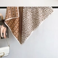 Elegant brown and beige silk scarf with geometric leaf patterns hanging gracefully - 68*68cm / Yellow