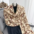 Elegant cream cashmere feel scarf with interlocking brown ring pattern and fringe details - Khaki