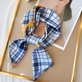 Blue and white plaid silk scarf with orange leaf pattern tied in a stylish bow - Blue and Yellow