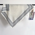 Detail of elegant paisley print silk square scarf hanging on a minimalist metal bar - Beige Paisley Print (68RZW184) / Off White
