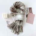 Classic brown and grey checkered scarf with fringes on a textured lifestyle background - Khaki