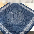 Macro detail of navy blue paisley silk scarf with bohemian pattern on white desk - 68*68cm / Navy Blue